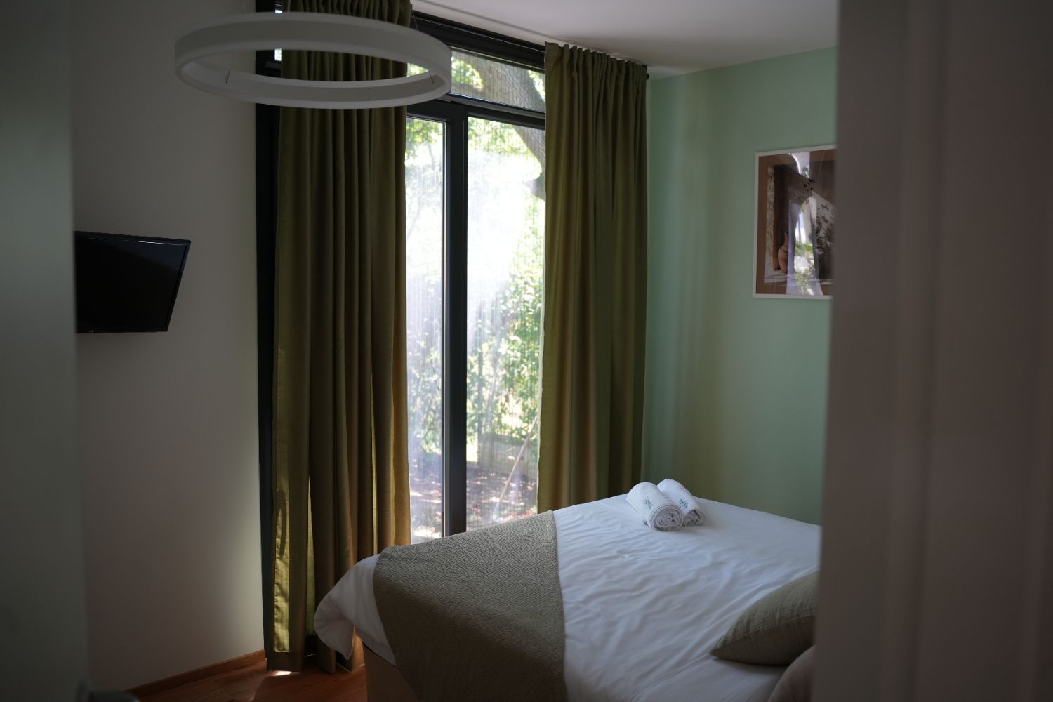 Sage-green bedroom